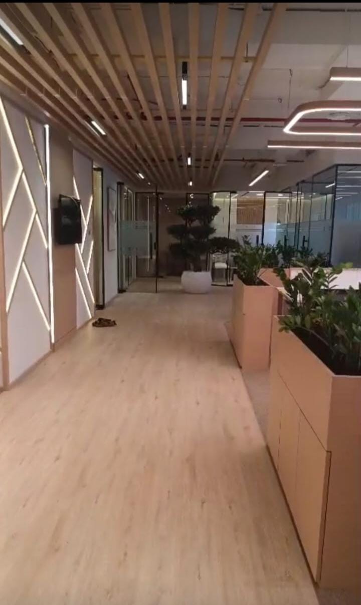 Finished office corridor with LVT wood-look flooring installed by Zale Interior in Dubai