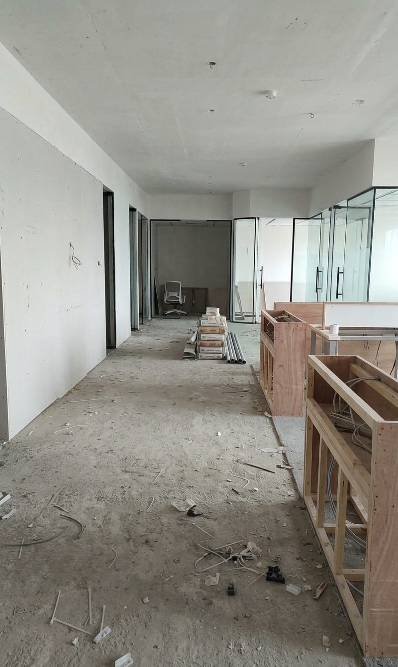 Unfinished office corridor before LVT flooring installation in Dubai by Zale Interior