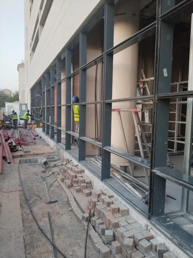 Aluminium frame installation for a glazed shopfront in the UAE