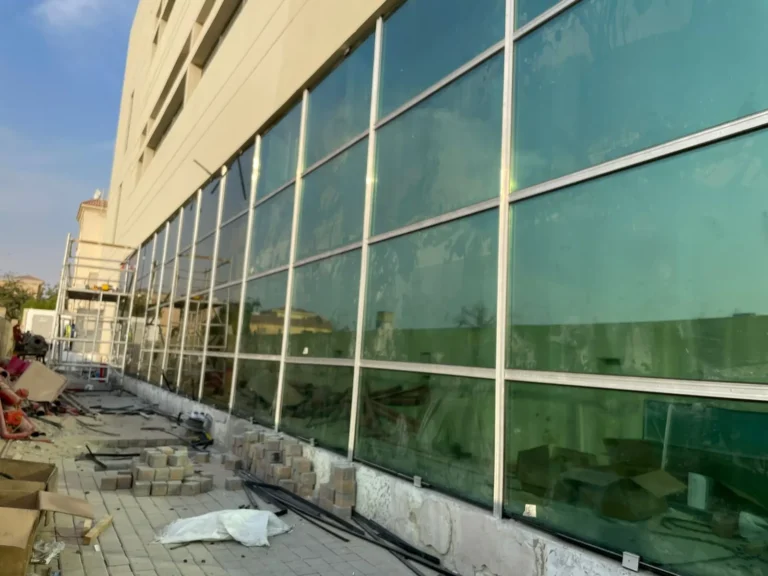 Aluminium-framed storefront glazing installed along a building frontage